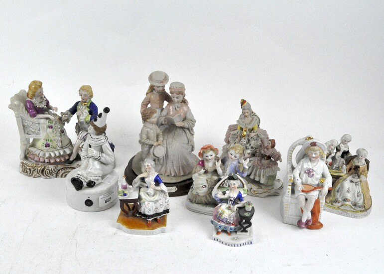 A collection of ceramic figures, late 19th/early 20th century, including a Dresden figure group