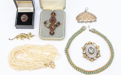 A collection of costume jewellery to include a gold garnet...