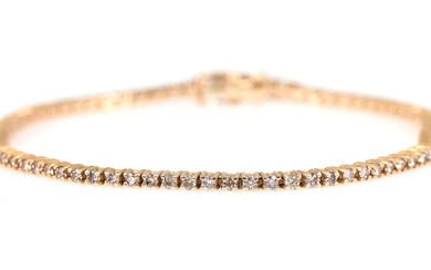 A diamond bracelet set with numerous brilliant-cut champagne coloured diamonds weighing a...