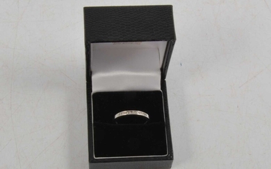 A diamond half eternity ring.