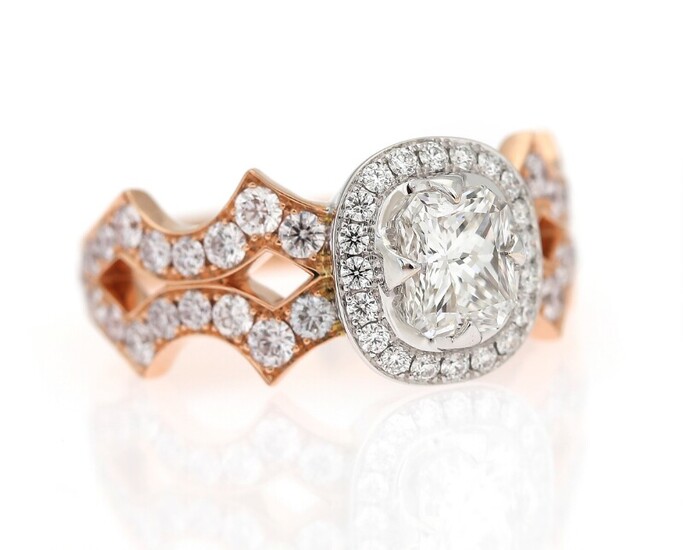 NOT SOLD. A diamond ring set with a diamond weighing 1.00 ct. encircled by diamonds...