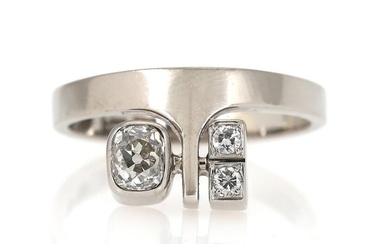 A diamond ring set with an old-cut and two brilliant-cut diamonds, mounted...