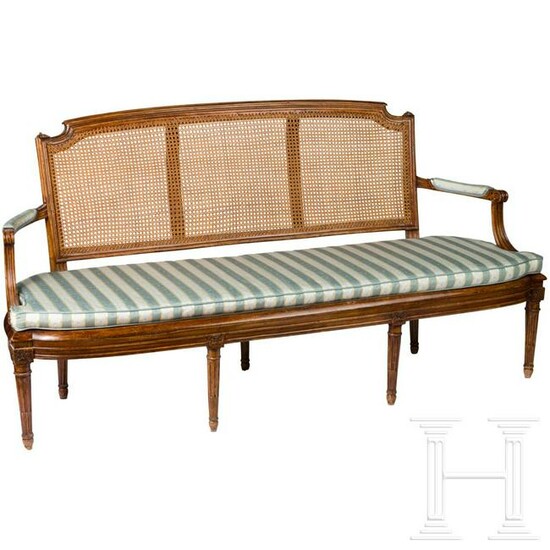 A fine French carved Louis XVI walnut settee, circa