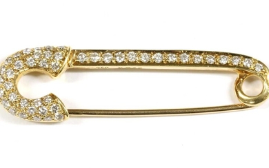 A gold, diamond set, safety pin-style brooch