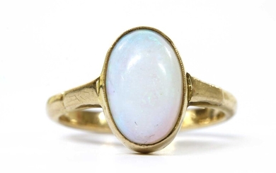 A gold single stone opal ring