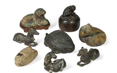 A group of eight Chinese bronze scroll weights