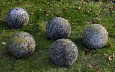 A group of five limestone ornamental spheres