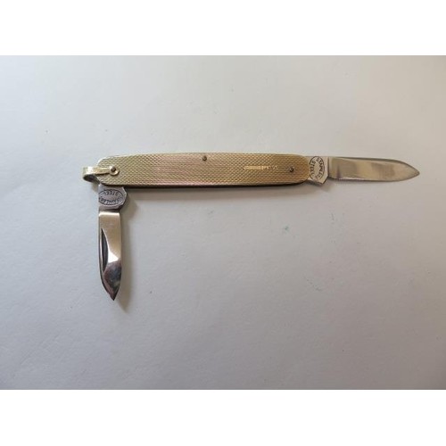 A hallmarked 9ct gold penknife with stainless steel blades, ...