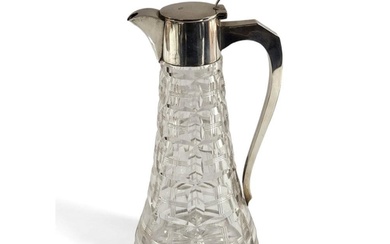 A hallmarked silver and clear cut glass claret jug, the tape...