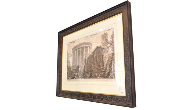 A large 18th century engraving after Piranesi, 62cm by 80.5cm, together with a further print...