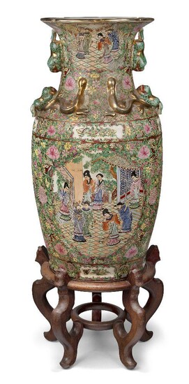 A large Chinese Canton vase, 20th century, decorated with panels of court figures in terrace settings surrounded by blossoms and butterflies, on a modern hardwood stand, 63cm - the vase, 86cm high overall