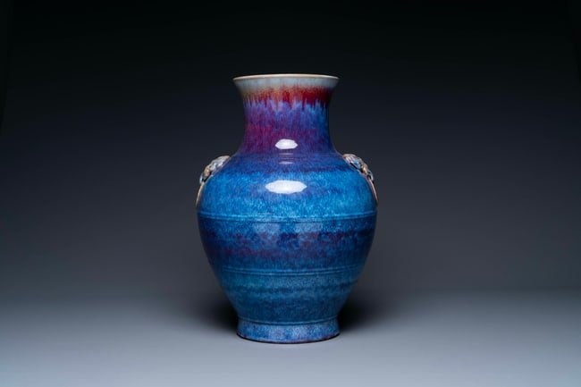 A large Chinese flambe glaze 'hu' vase with taotie handles, Qing