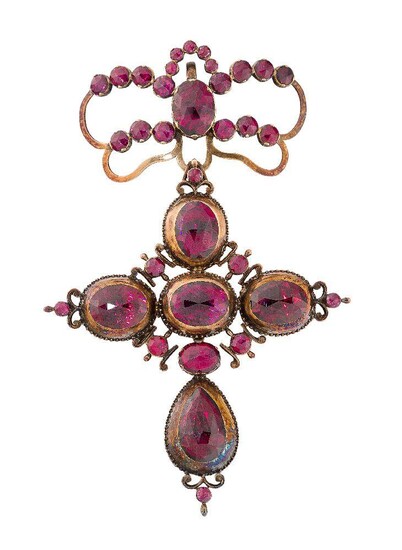 A late 18th century Iberian gold and foiled garnet cross pendant, of pendeloque form, the cross comprising four oval rose-cut garnets suspending a single pear shaped rose-cut garnet with circular and oval rose-cut garnet accents, to a stylised bow...