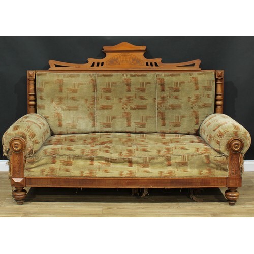 A late Victorian Eastlake style sofa, rectangular back crest...