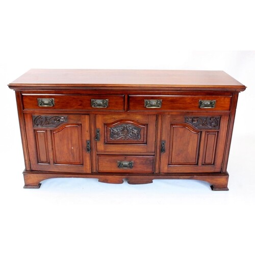 A late Victorian walnut sideboard, the rectangular moulded t...