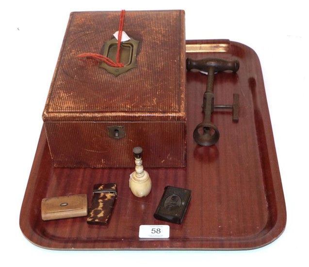 A leather correspondence box; a 19th century corkscrew; a bone...