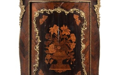 A marquetry and ormolu mounted corner cupboard