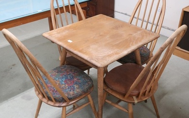 A mid 20th century Ercol elm and beech model 395 table with ...