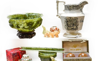 A modern Chinese jade bowl on wooden stand, together...