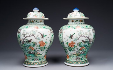 A pair of Chinese famille verte 'bird and flower' vases and covers, Kangxi mark, 19th C.