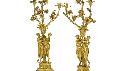 A pair of French gilt bronze and white marble candelabra, each with...