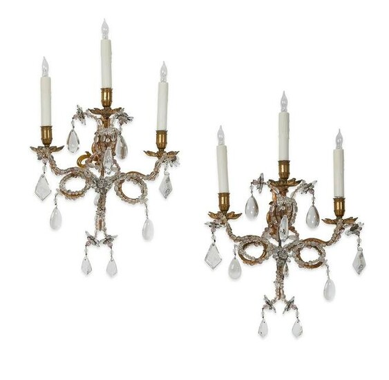 A pair of French gilt metal & glass wall lights