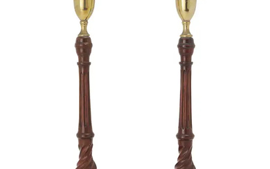 A pair of George III style turned mahogany candlesticks, 20th century, the...