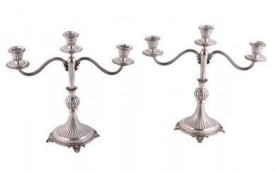 A pair of Italian silver coloured three light candelabra by Piero Arioli