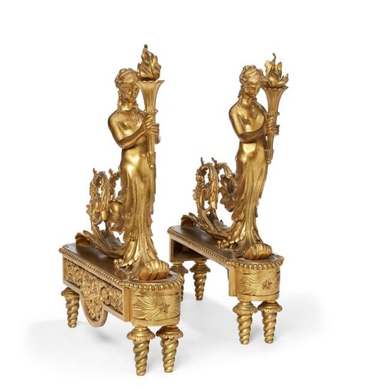A pair of Louis XVI style gilt bronze chenets