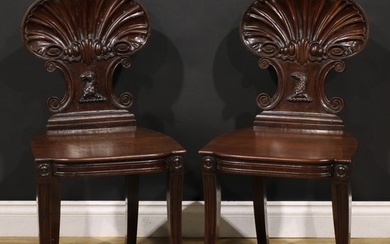 A pair of Post-Regency mahogany hall chairs, in the manner o...