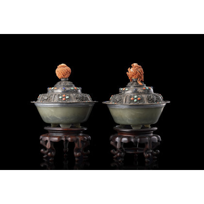 A pair of celadon green jade bowls, with metal mounts and silvered copper covers with faux gems, handles with coral...