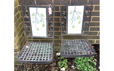 A pair of folding painted metal garden chairs with lattice s...