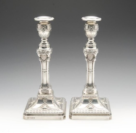 A pair of modern silver candlesticks in Neo-Classical