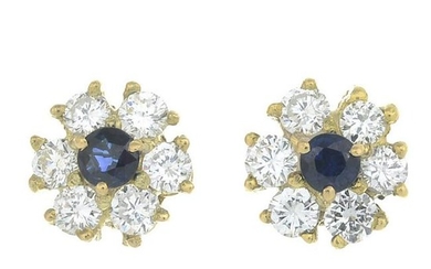 A pair of sapphire and diamond earrings.Total sapphire