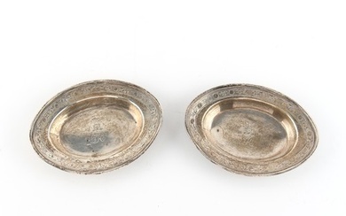 A pair of small George III silver oval dishes, each with eng...