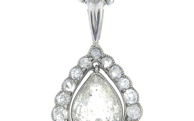 A pear-shape diamond, with old-cut diamond surround