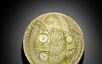 A rare intact Abbasid lustre pottery bowl depicting a griffin,...