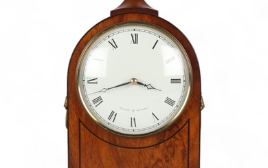 A reproduction mahogany cased dome-top mantel clock, on bras...