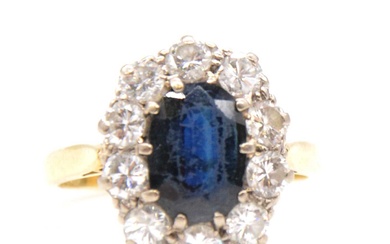 A sapphire and diamond oval cluster ring