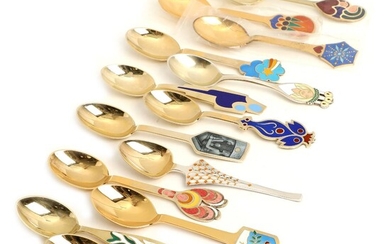SOLD. A set of 13 Christmass partly gilt sterling silver spoons, decorated with enamel. A....