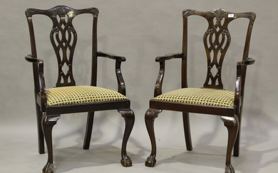 A set of seven early 20th century George III style mahogany pierced and carved splat back dining cha