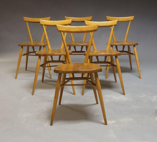 A set of six Ercol beech and elm stacking chairs, circa 1960s, designed by Lucian R Ercolani in 1957, 75cm high
