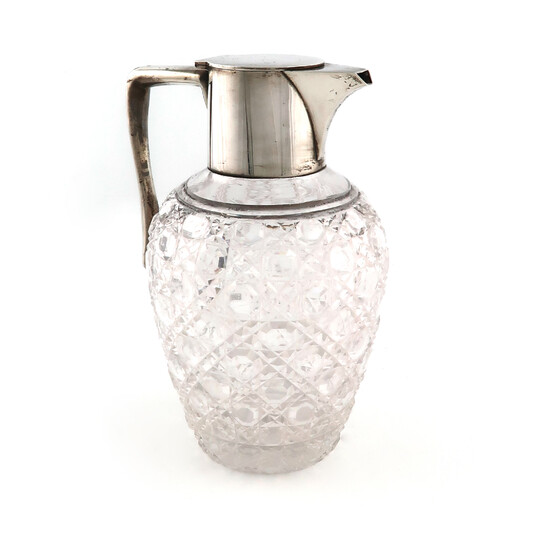A silver-mounted glass claret jug