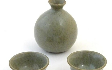 A studio pottery Japanese saki set with a crackle