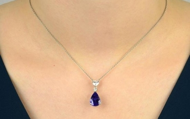 A tanzanite and diamond pendant, on chain. Tanzanite