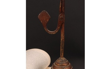 A wrought iron nip rushlight holder, stepped circular wood b...