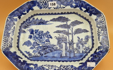 AN 18th C. CHINESE BLUE AND WHITE PLATTER CENTRALLY PAINTED WITH BAMBOO, ROCKS AND A PEONY ON AN