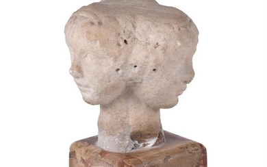 AN UNUSUAL CARVED MARBLE VULTUS TRIFRONS OR THREE FACED CAPITAL, IN THE ITALIAN 15TH CENTURY STYLE