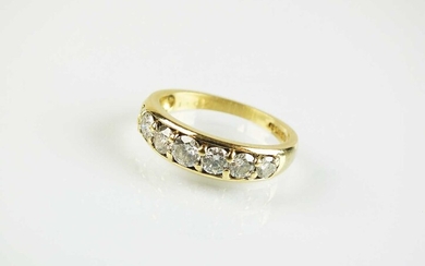 An 18ct yellow gold seven stone diamond ring