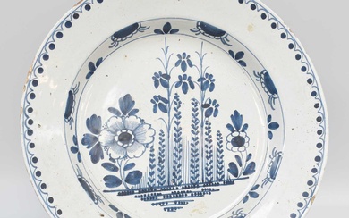 An 18th Century English Delft Blue and White Charger Ther...